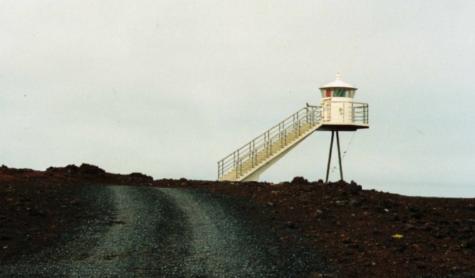 lighthouse in the lava field of Heimaey (Westmannaeyjar Islands)